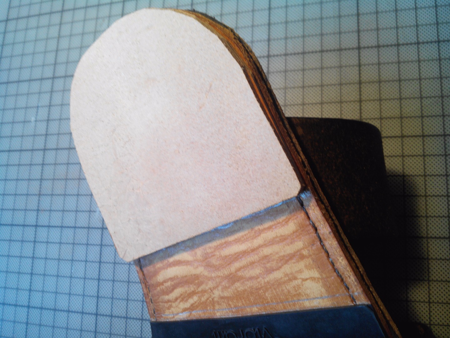 64 glue two ply of leather to built the heel.jpg