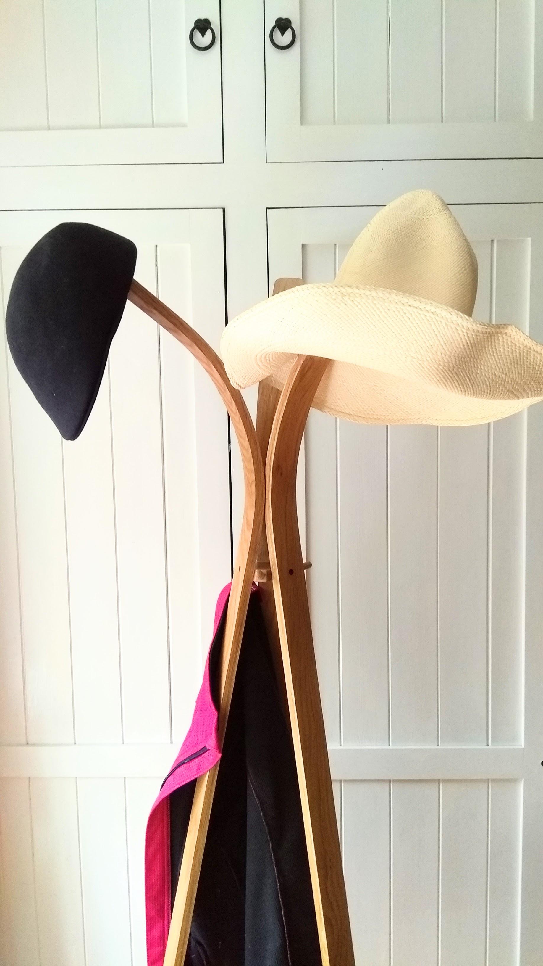 Coat stand with jacket and hats.jpg