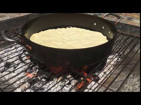 Cooking a pizza on a cast-iron skillet on my firepit