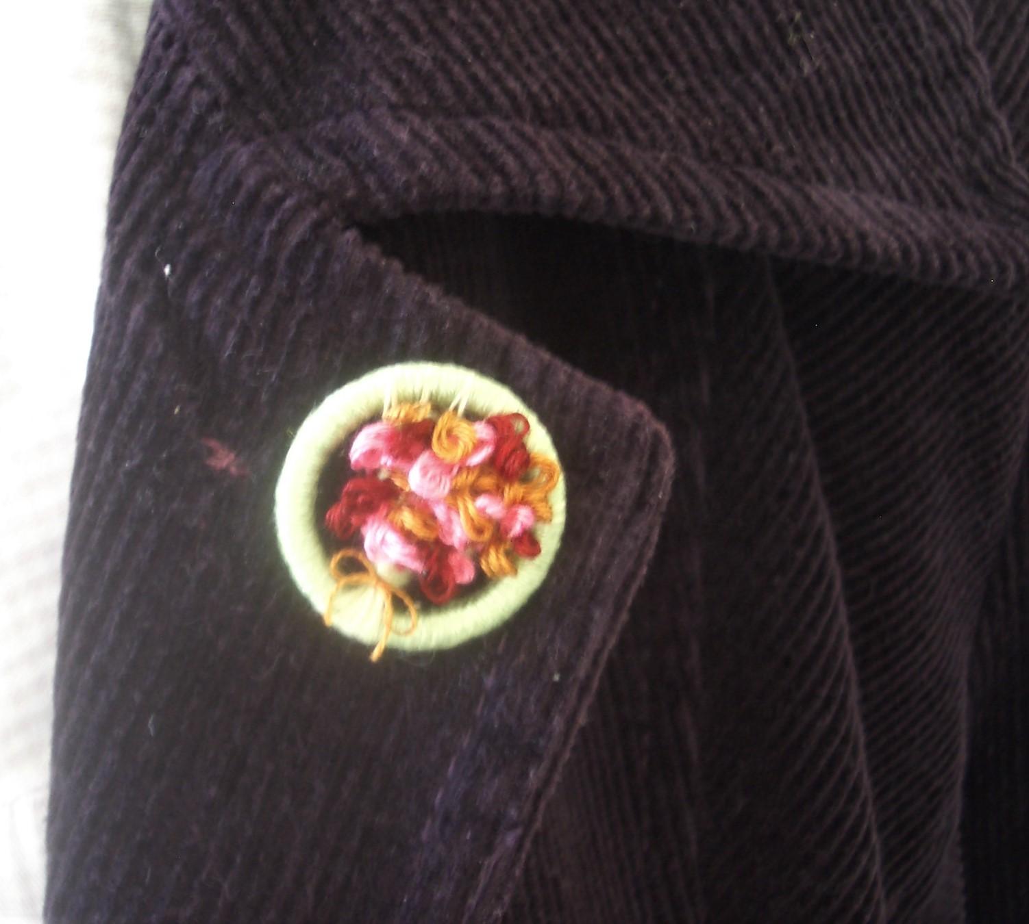 Red and pink Dorset button o lapel.JPG