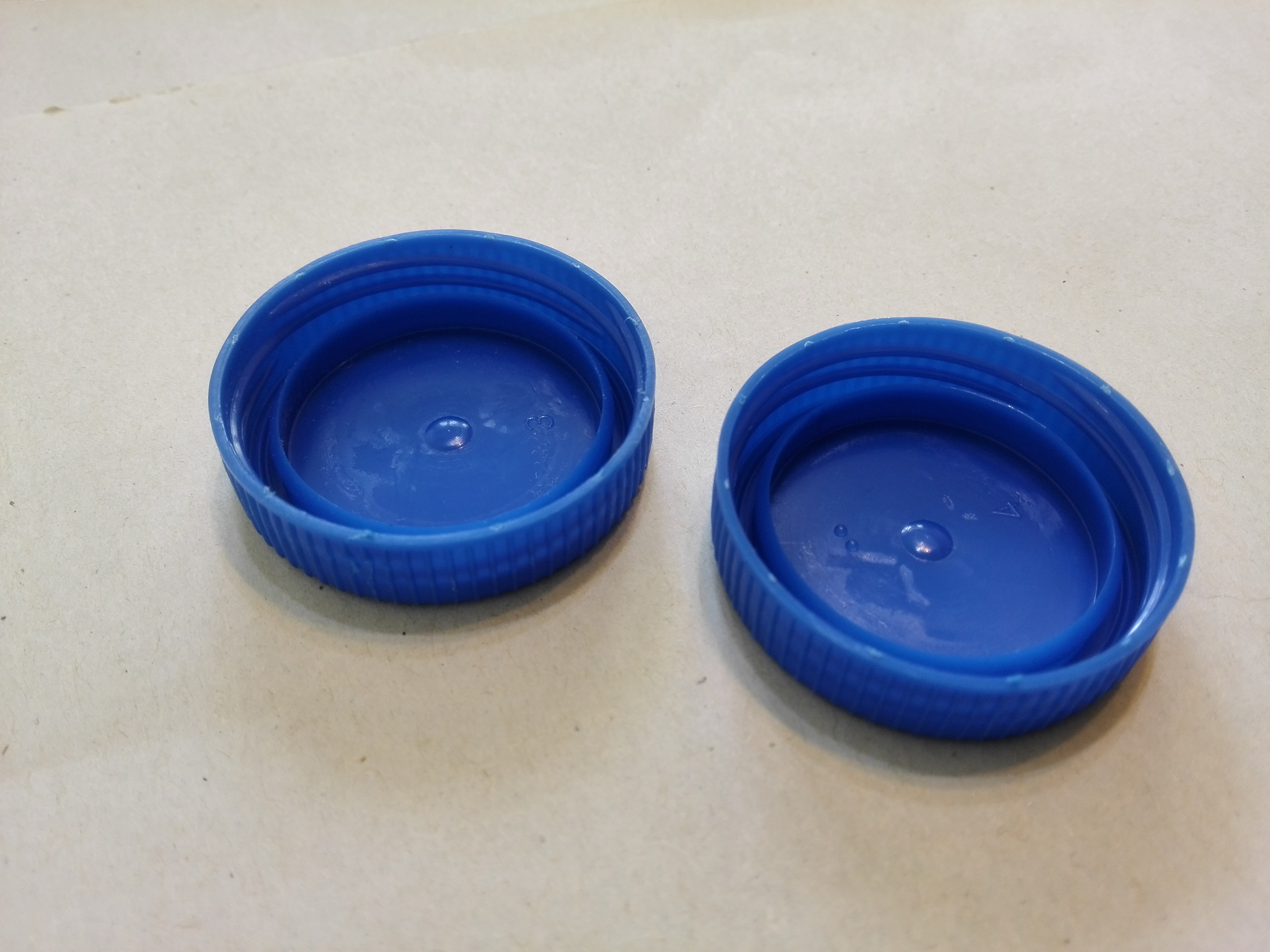 Two Little Same Plastic Bottle Caps.jpg