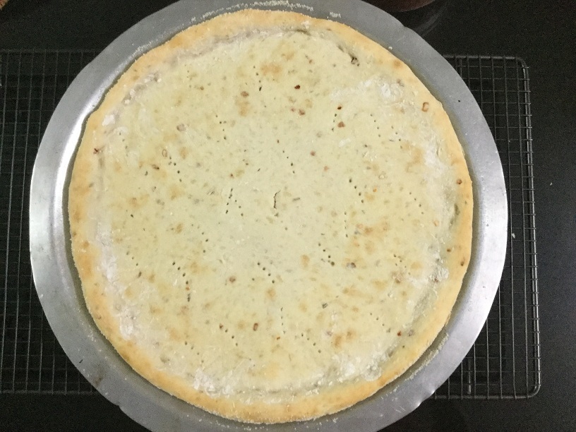 baked pizza in pan.jpg