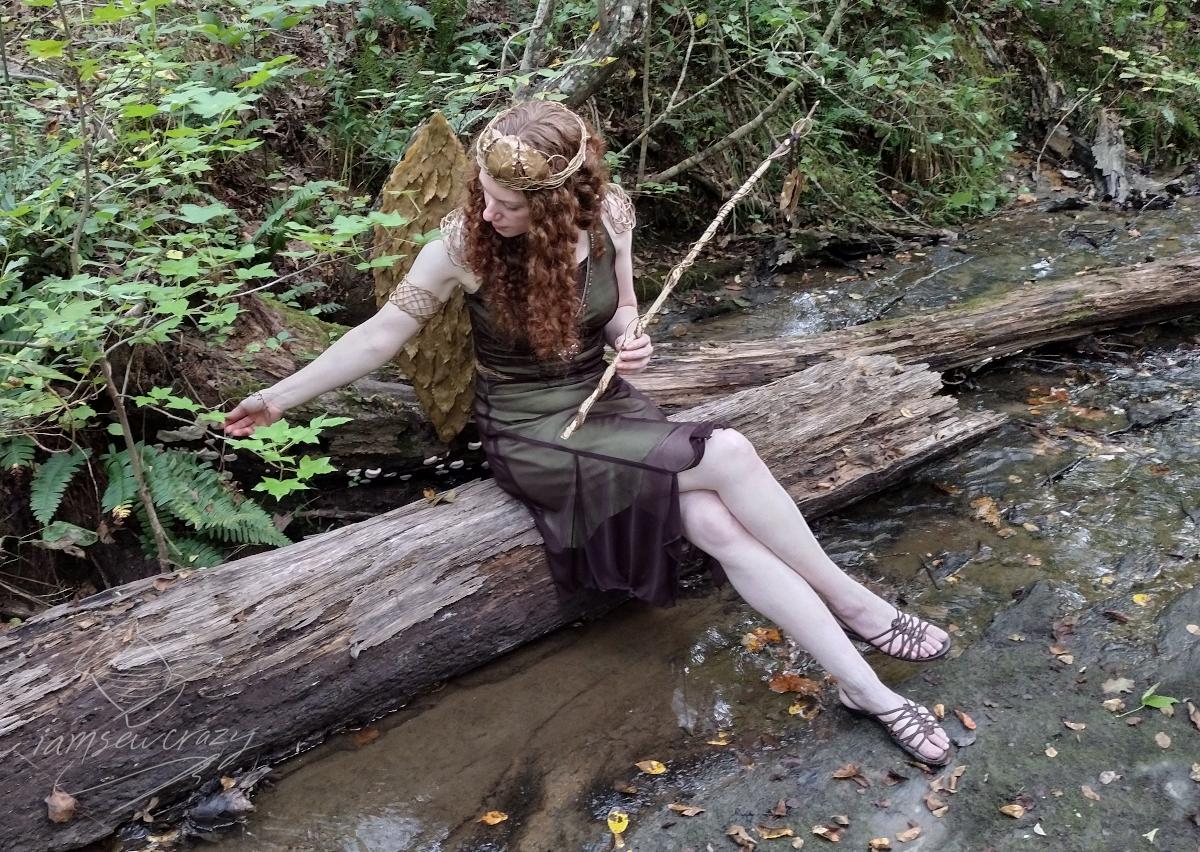 fairy sitting on fallen log in creek.jpg