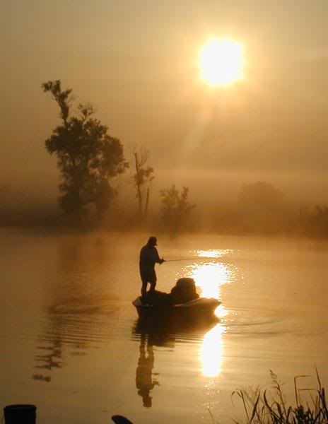 man_in_sun_drenched_fishing_boat_on.jpg