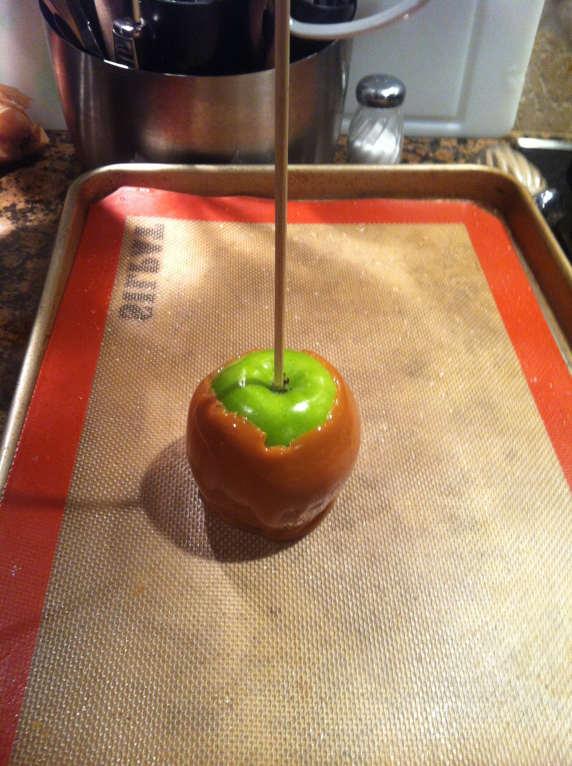 one carmel apple on mat.jpg