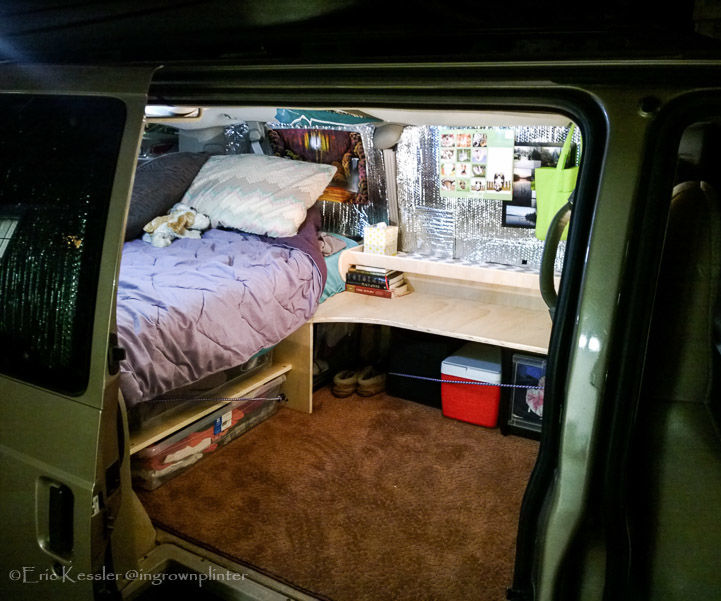 Van Turned Dorm Room, Complete With Bed and Desk